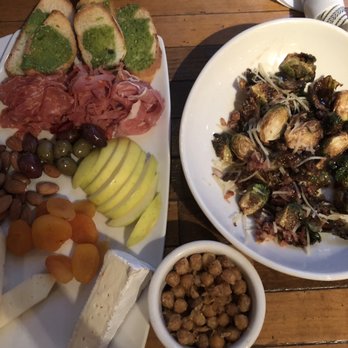 Benchmark Eatery - Charcuterie board, complementary chick peas, and brussel sprouts with bacon. Yum! - New American Near Me - Santa Barbara, California