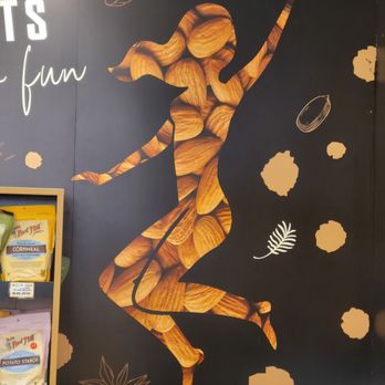 Nuts Factory - Astoria - a woman running with almonds - Specialty Food Near Me - Astoria, New York Nuts Factory - Astoria - a woman running with almonds - Specialty Food Near Me - Astoria, New York