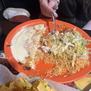 Taco Tequila Bar - Cheese quesadilla that comes with side of rice, lettuce, tomato, sour cream, and guacamole. Also comes with queso on the top. - Mexican Near Me - Hillsboro, Missouri Taco Tequila Bar - Cheese quesadilla that comes with side of rice, lettuce, tomato, sour cream, and guacamole. Also comes with queso on the top. - Mexican Near Me - Hillsboro, Missouri