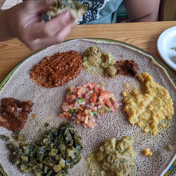 Ethiopis - Large Sampler with Lamb stew(mild) Key Wot (beef stew) and an array of veg. AMAZING flavor and texture profiles. Absolutely delicious! - Ethiopian Near Me - Rockville, Maryland Ethiopis - Large Sampler with Lamb stew(mild) Key Wot (beef stew) and an array of veg. AMAZING flavor and texture profiles. Absolutely delicious! - Ethiopian Near Me - Rockville, Maryland