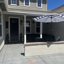 Brick House Masonry and Concrete Designs - Front porch with stamped concrete and retaining wall