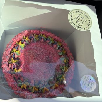 Ashley’s Sugar On Top - 10 inch strawberry cake with strawberry filling and strawberry lemonade frosting, and a lot of glitter! - Cupcakes Near Me