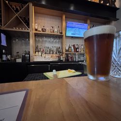 Baba restaurant - Drinking a Ro-sham-bo amber ale (red) at the bar.