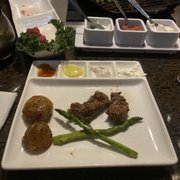 Photo of The Melting Pot - Darien, CT, United States. Premium Filet Mignon and asparagus with potatoes