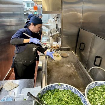 Chief Beef Noodles - Final step of my noodle soup being prepared. Btw, she's not smoking. Lol - Chinese Near Me - Queens, New York Chief Beef Noodles - Final step of my noodle soup being prepared. Btw, she's not smoking. Lol - Chinese Near Me - Queens, New York