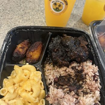 The Jerk Grill - Oxtail Meal Combo and mango passion fruit drink. - Caribbean Near Me - Redlands, California The Jerk Grill - Oxtail Meal Combo and mango passion fruit drink. - Caribbean Near Me - Redlands, California