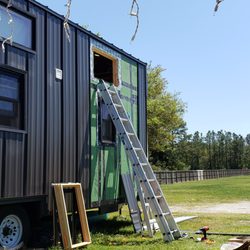 Tumbleweed Tiny House - Repairing the window they broke during delivery that they refused to fix even though their warranty held them responsible.