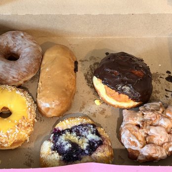 Gracie's Luncheonette - Vanilla Glazed, Maple Bar, Boston Cream, Mango Coconut, Blueberry, and a Maple Fritter - American Near Me - Leeds, New York Gracie's Luncheonette - Vanilla Glazed, Maple Bar, Boston Cream, Mango Coconut, Blueberry, and a Maple Fritter - American Near Me - Leeds, New York