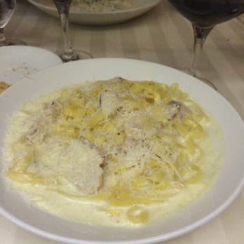 La Strada - Fettuccine Alfredo with Chicken in the forefront- mushroom ravioli in the back. - Italian Near Me - Reno, Nevada La Strada - Fettuccine Alfredo with Chicken in the forefront- mushroom ravioli in the back. - Italian Near Me - Reno, Nevada