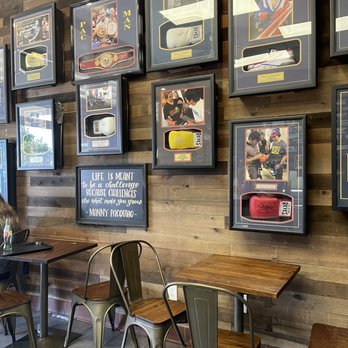 Pinoy BBQ ATBP - a wall of framed memorabilia - Barbeque Near Me - Milpitas, California