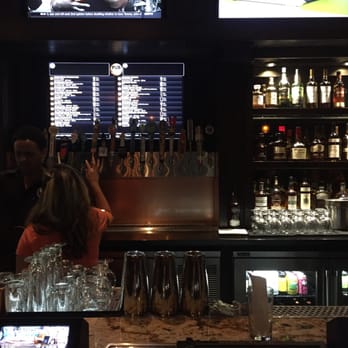 Pub 365 - The screen in the back roles through all the beers on tap. Melese on the left - Beer Bar Near Me - Las Vegas, Nevada Pub 365 - The screen in the back roles through all the beers on tap. Melese on the left - Beer Bar Near Me - Las Vegas, Nevada