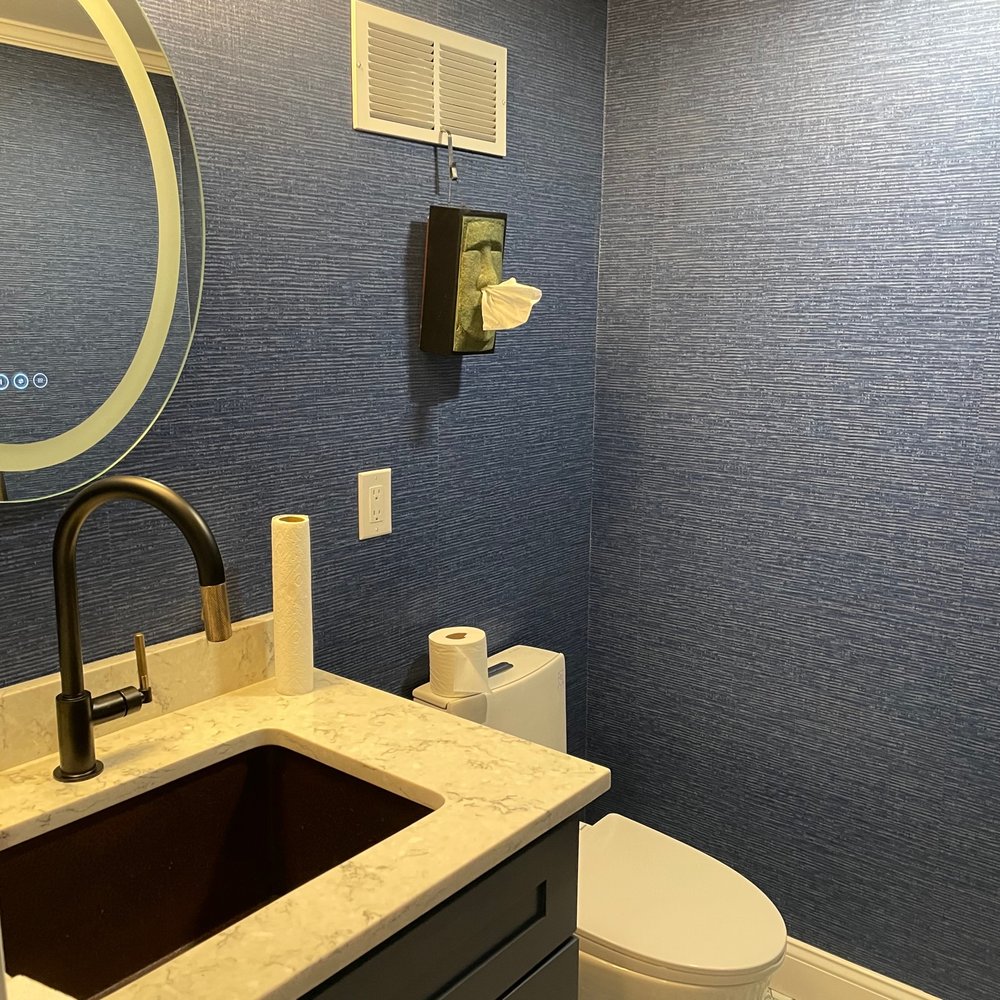 Ambler Contracting - Beautifully designed bathroom with large copper sink, modern mirror and toilet - General Contractors Near Me Ambler Contracting - Beautifully designed bathroom with large copper sink, modern mirror and toilet - General Contractors Near Me