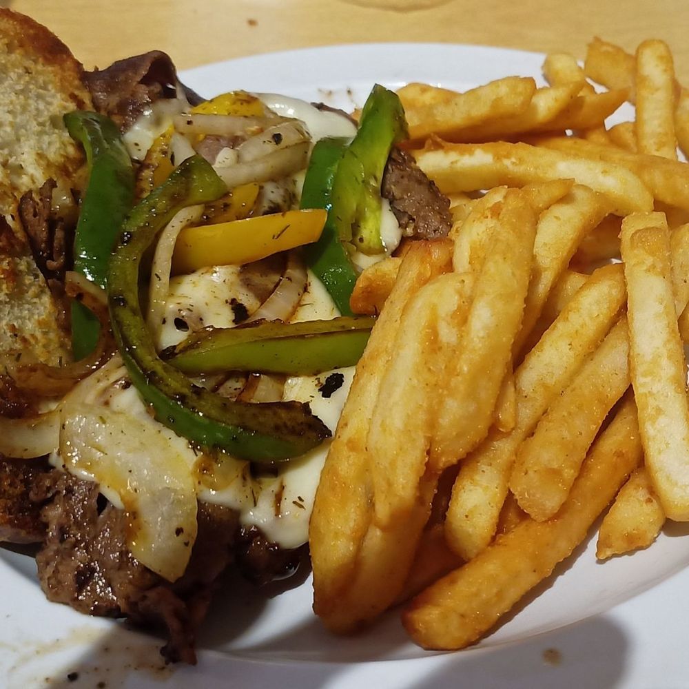 Miller's Grocery - Philly Cheesesteak Sandwich with steak fries, served hot! - Southern Near Me - Cristiana, Tennessee Miller's Grocery - Philly Cheesesteak Sandwich with steak fries, served hot! - Southern Near Me - Cristiana, Tennessee
