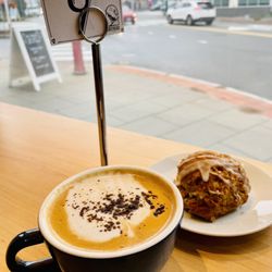 Ovenbird Cafe - Maple cardamom decaf latte with almond milk and a pumpkin pecan gluten free biscuit / Oct. 2022