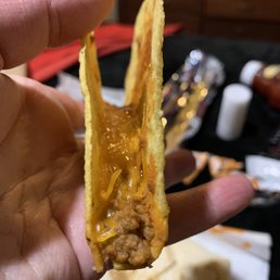 a hand holding a tortilla a hand holding a tortilla