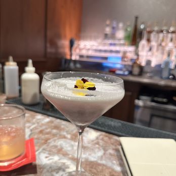 Salt - a cocktail in a martini glass on a bar - New American Near Me - Amelia Island, Florida