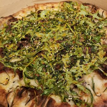 Young Joni - Korean BBQ beef short ribs, mozzarella, scallion, arugula, sesame, soy chili vinaigrette - Pizza Near Me - Minneapolis, Minnesota Young Joni - Korean BBQ beef short ribs, mozzarella, scallion, arugula, sesame, soy chili vinaigrette - Pizza Near Me - Minneapolis, Minnesota
