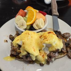H and F By Hand and Fork - Eggs Benedict over a steak filet with mushrooms and onions and a fruit plate!