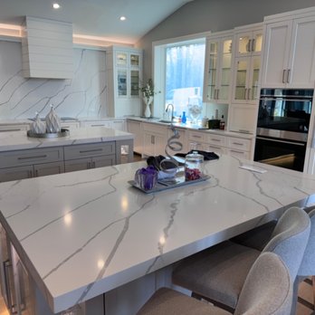 Granite And Marble Direct - Double island kitchen in Calacatta quartz with a full-height slab backsplash. Granite & Marble Direct, New Brighton MN. - Building Supplies Near Me - New Brighton, Minnesota Granite And Marble Direct - Double island kitchen in Calacatta quartz with a full-height slab backsplash. Granite & Marble Direct, New Brighton MN. - Building Supplies Near Me - New Brighton, Minnesota