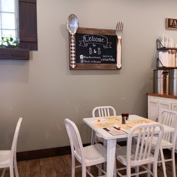 The Brunch Box - a table and chairs in a restaurant - New American Near Me - Lakeland, Florida The Brunch Box - a table and chairs in a restaurant - New American Near Me - Lakeland, Florida
