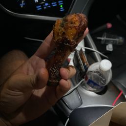 a hand holding a piece of food a hand holding a piece of food