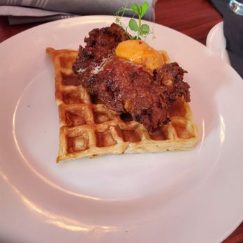 The Manor - Chicken with a waffle. My gf said she expected at least two waffles, but it still was good. 04/03/22 - Lounges Near Me - Baltimore, Maryland