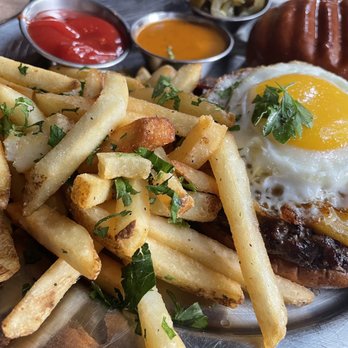 Eureka! - Jalapeño Egg Burger and Truffle Parmesan Fries. Side of chipotle sauce and ketchup. - American Near Me - Austin, Texas Eureka! - Jalapeño Egg Burger and Truffle Parmesan Fries. Side of chipotle sauce and ketchup. - American Near Me - Austin, Texas