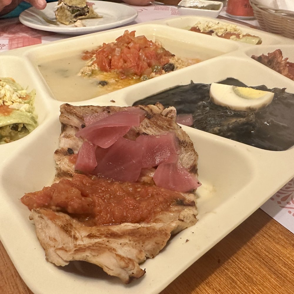 Platter with relleno negro, queso relleno, poc-chuc, and papadzules, Platter with relleno negro, queso relleno, poc-chuc, and papadzules,