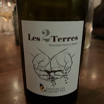 Sardines - a bottle of wine on a table - Seafood Near Me - Quebec City, Quebec Sardines - a bottle of wine on a table - Seafood Near Me - Quebec City, Quebec