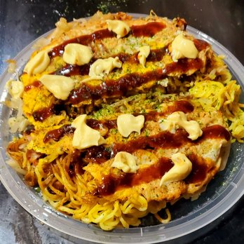 Oconomi - Hiroshima Style Okonomiyaki.The different ingredients are layered. Noodles are one layer. I put on the toppings. Unique and delicious. - Japanese Near Me - Long Island City, New York