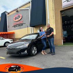 Orange Auto Sales - My salesman Arón, myself, and my beautiful new car!! Thank you Arón, your staff and Orange Auto Sale for everything!!
