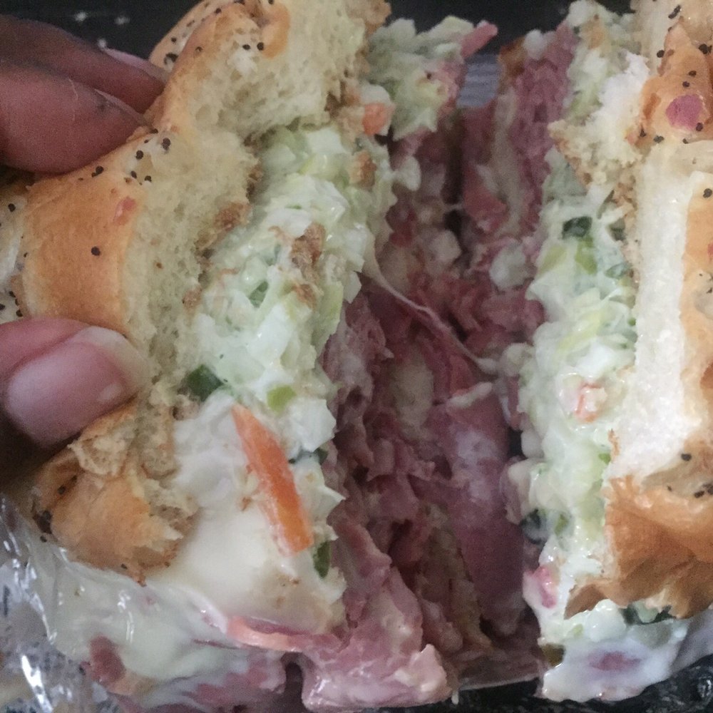 Mr. Corned Beef - a half eaten sandwich - Delis Near Me - Highland Park, Michigan