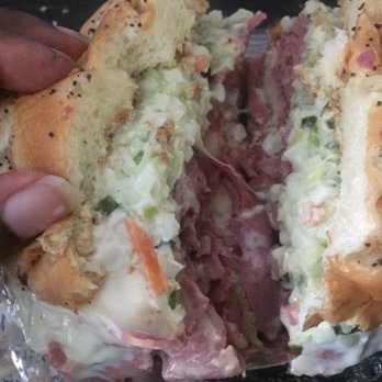 Mr. Corned Beef - a half eaten sandwich - Delis Near Me - Highland Park, Michigan