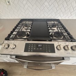 AV Appliance Repair - GE stove. Replaced the main control board and installed a new overlay to restore proper operation of the oven controls.