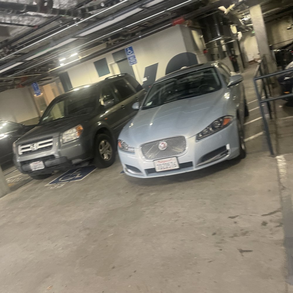 Here are the property manager's and staff's cars all lined up in the handicap parking spots! Here are the property manager's and staff's cars all lined up in the handicap parking spots!