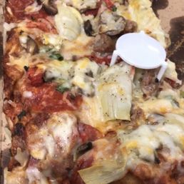 Half eaten Tuscan pizza Half eaten Tuscan pizza