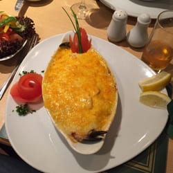 Old Pier - Seafood mornay: salmon, mussels, prawns, haddock, and crab claws in a cheese and wine sauce