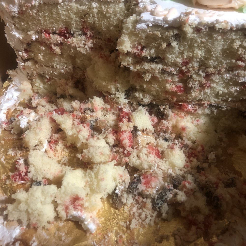 HORRIBLY DRY CHERRY NUT CAKE WITH BARELY ANY NUTS AND HORRIBLE FLAVOR. Every piece that was cut was falling apart because it was so dry. HORRIBLY DRY CHERRY NUT CAKE WITH BARELY ANY NUTS AND HORRIBLE FLAVOR. Every piece that was cut was falling apart because it was so dry.