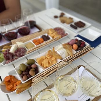 Migration Winery - a variety of wine and cheeses - Wine Tasting Room Near Me - Napa, California Migration Winery - a variety of wine and cheeses - Wine Tasting Room Near Me - Napa, California