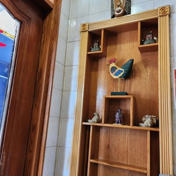 Kum Sung BBQ - a wooden shelf with a mask on it - Korean Near Me - Flushing, New York Kum Sung BBQ - a wooden shelf with a mask on it - Korean Near Me - Flushing, New York