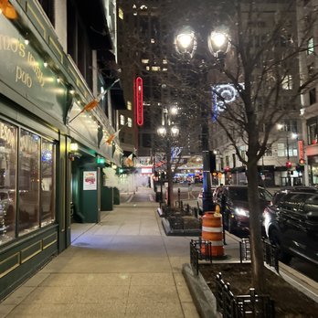 Mo's Irish Pub - a city street at night - New American Near Me - Milwaukee, Wisconsin