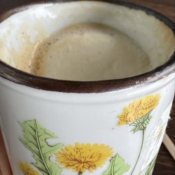 Rosalind Bakery - Close-up of Personal cup w cap in it, leaned over. I took a sip out of it so it was up to the top. Strong coffee, good foam, small serving. - Bakeries Near Me - Pacifica, California