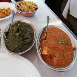 Palak paneer and chicken Tika malsala. Dish at the back is a potato cauliflower dish. All delicious!