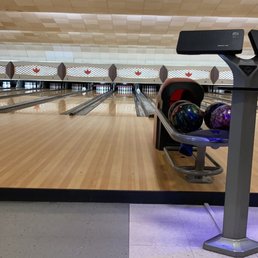 a bowling alley with bowling balls a bowling alley with bowling balls