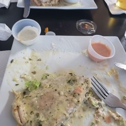 Raices Latin & International Cuisine - Chicken in garlic and cilantro great taste. Wife had chicken wrapped with stuffed with cheese bacon and cilantro. Both had great flavor.