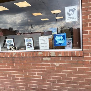 Lucci's Place - a brick storefront window - Pizza Near Me - Kent, Ohio