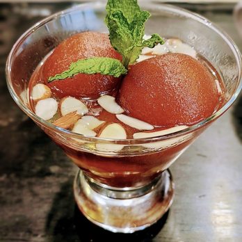 Aha The Indian Grill - Gulab Jamun - Milk Dumplings in a warm sweet syrup. Almost like a syrup-soaked mini pancake! - Indian Near Me - Spring Hill, Tennessee Aha The Indian Grill - Gulab Jamun - Milk Dumplings in a warm sweet syrup. Almost like a syrup-soaked mini pancake! - Indian Near Me - Spring Hill, Tennessee