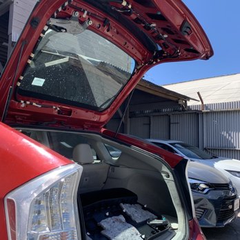 Auto Body Garage - Interior panels removed to reattach exterior upper black spoiler. - Auto Repair Near Me - San Francisco, California
