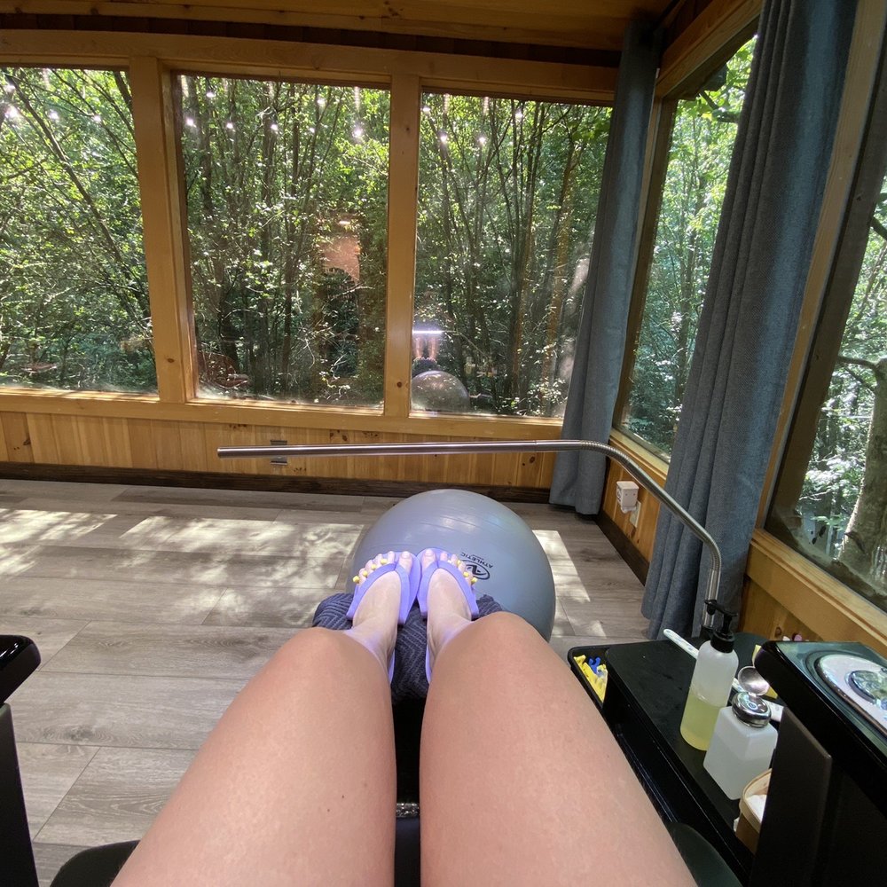 Pedicure stool with huge windows looking out into the trees. Pedicure stool with huge windows looking out into the trees.