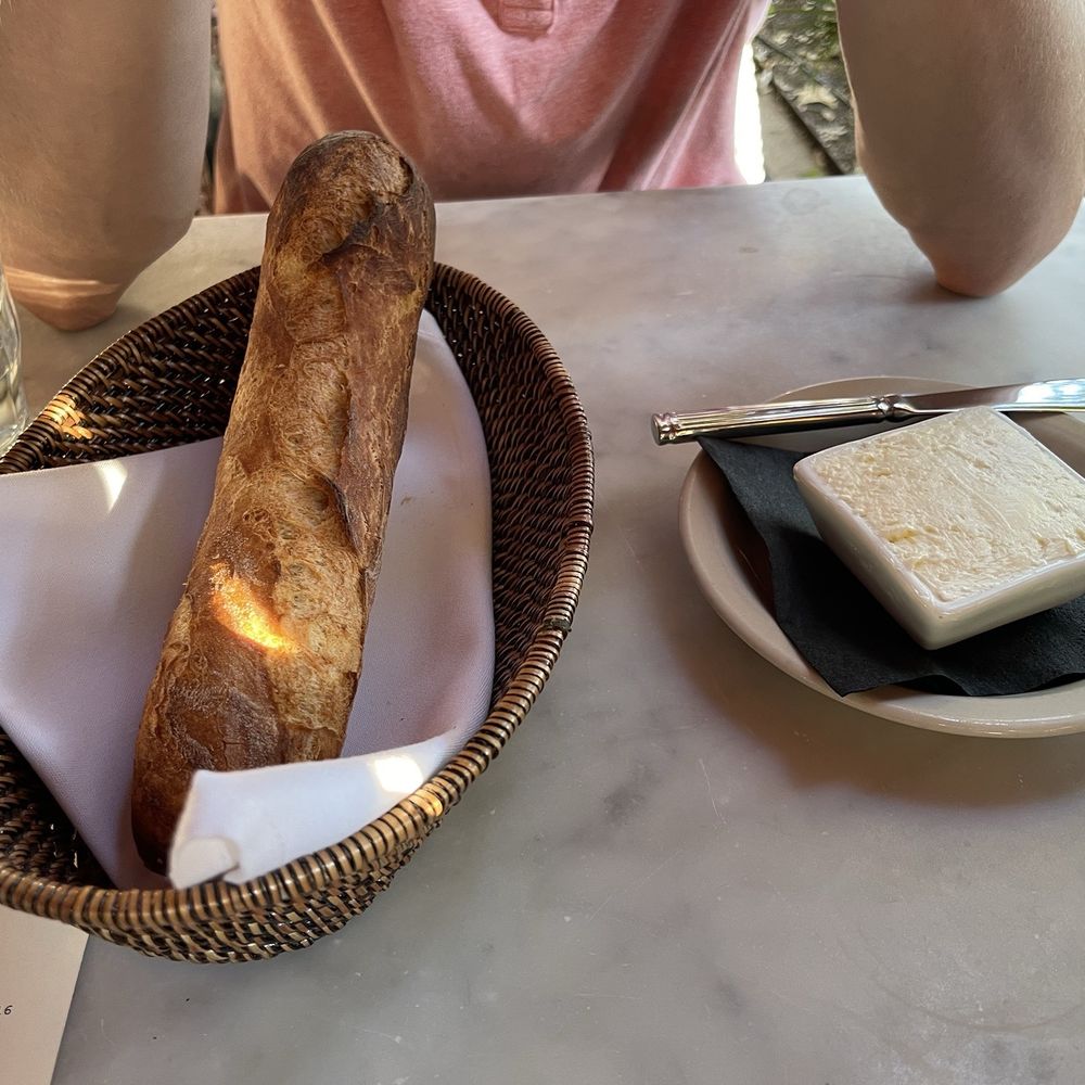 Justine's Brasserie - Bread and butter. The bread was a tad burnt on the ends. - French Near Me - Austin, Texas Justine's Brasserie - Bread and butter. The bread was a tad burnt on the ends. - French Near Me - Austin, Texas